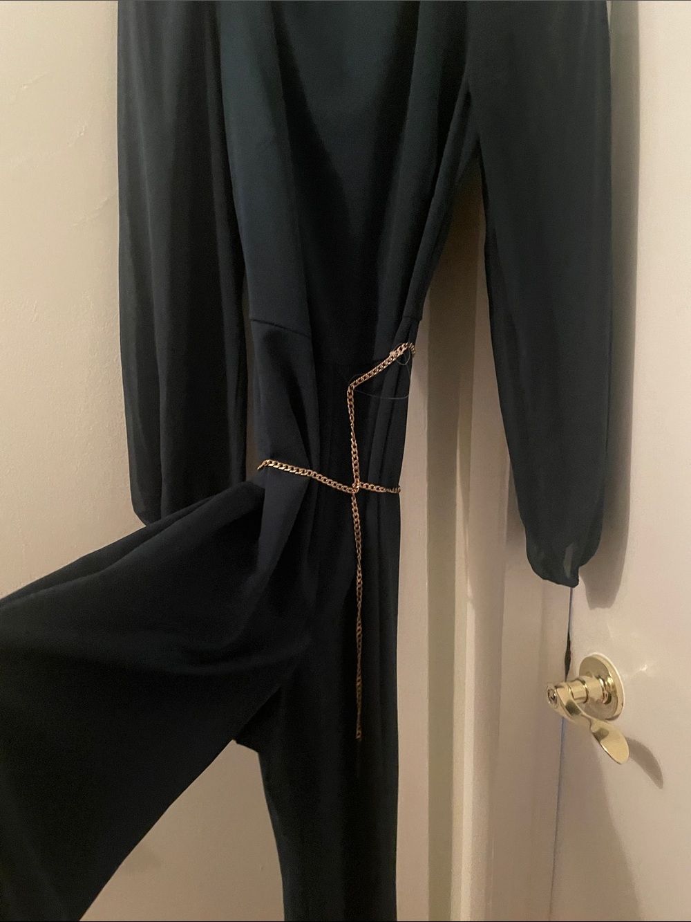 connected apparel Black Long-Sleeve Jumpsuit with Gold Chain Detail